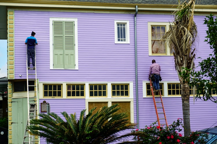 Men Painting a Building